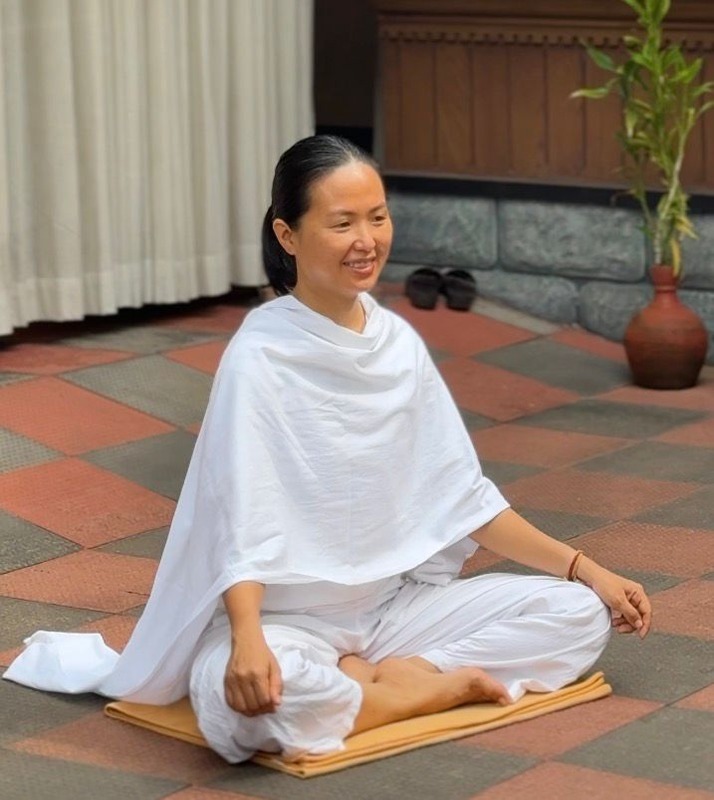 Jennie Nguyen seated in meditation